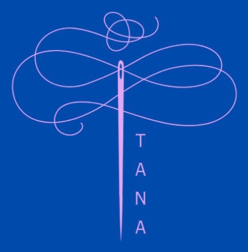 TANA — a sewing needle with thread flourishes shaped like a dragonfly